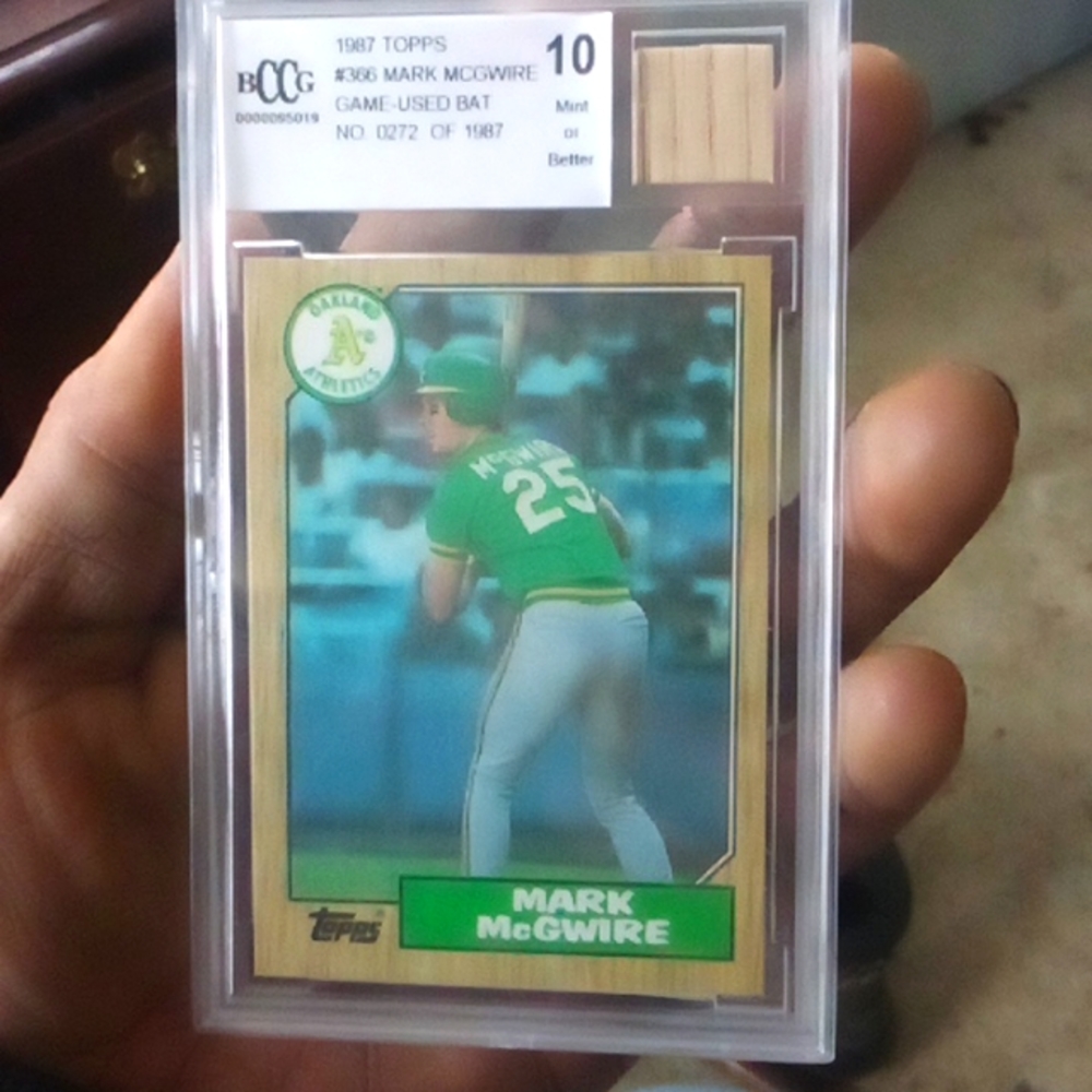 1987 Topps #366 Mark McGwire with game used bat. 10 mint or better